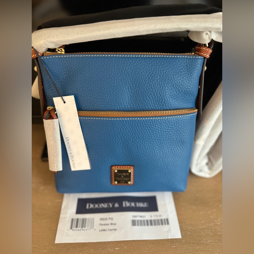 New. Never used. Dooney & Bourke Persian Blue Leather Letter Carrier